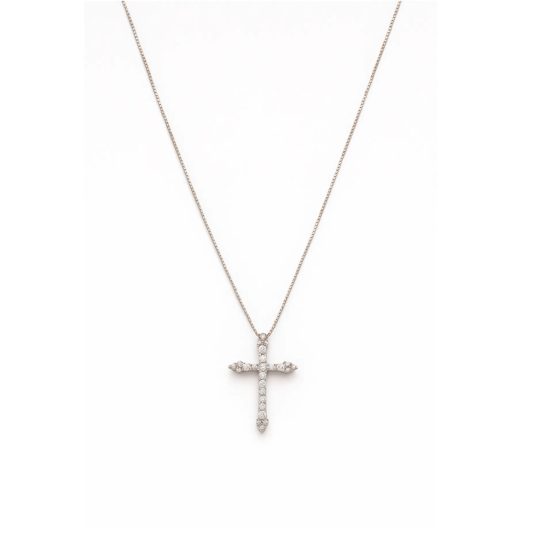 Front view of the dainty diamond cross pendant on its delicate chain
