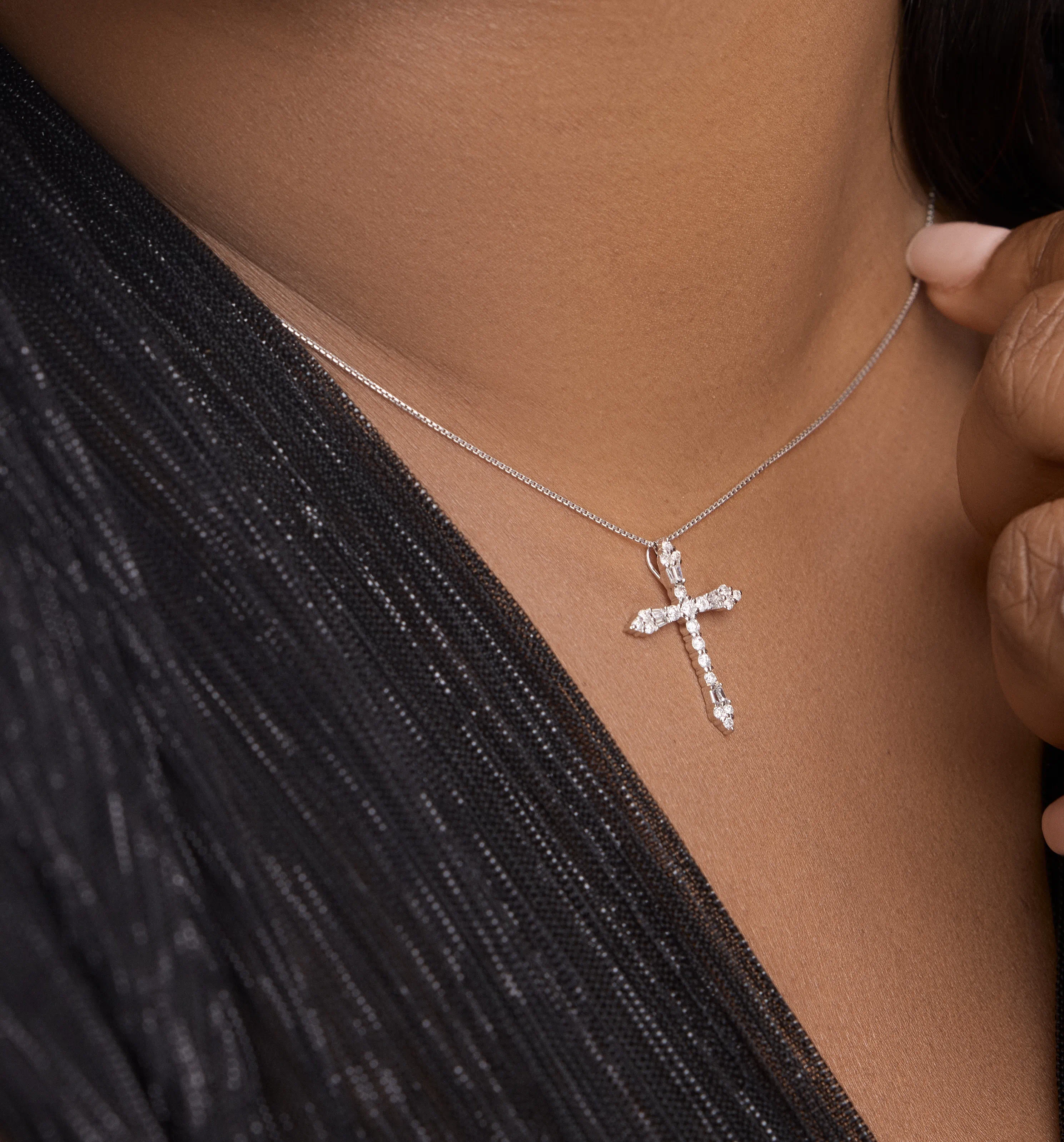 Angle view showing the sparkle of diamonds on the white gold cross