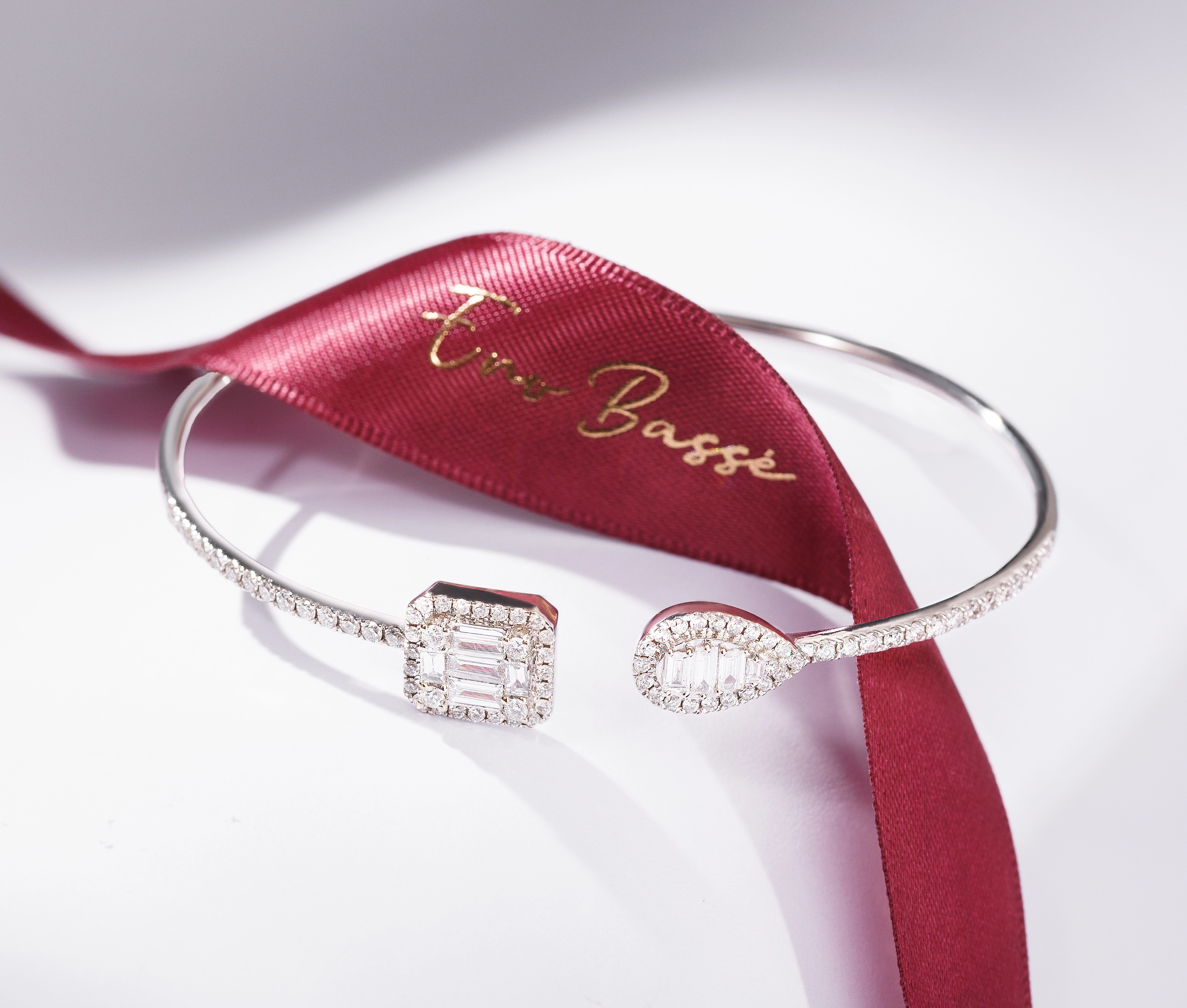 Angled view showing the dimensional design of the diamond bangle
