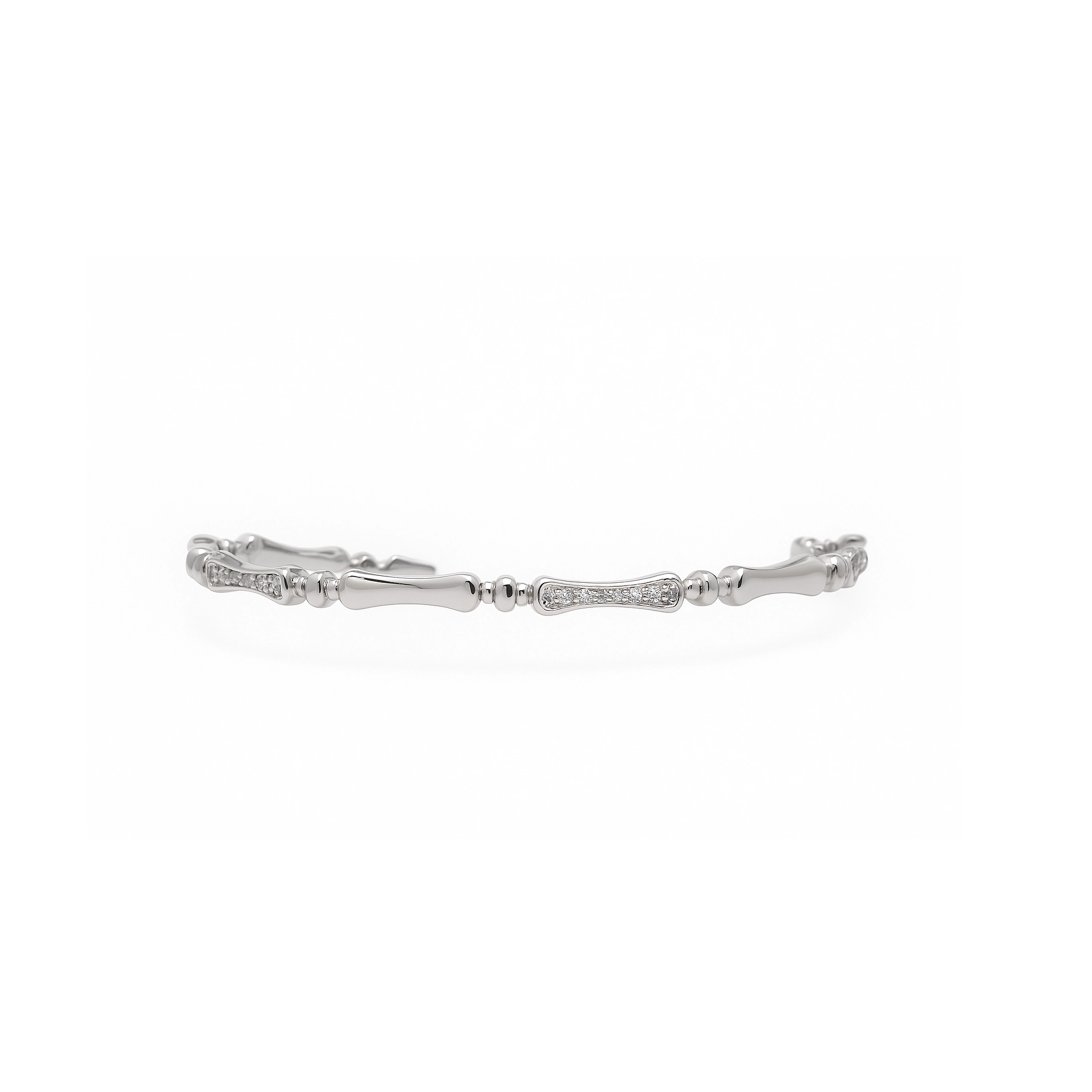 Bamboo tennis bracelet catching light with polished white gold finish
